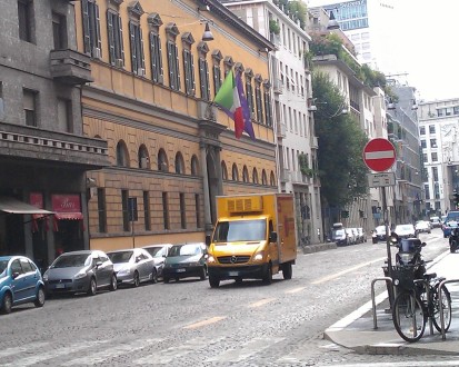 City street scene with yellow truck